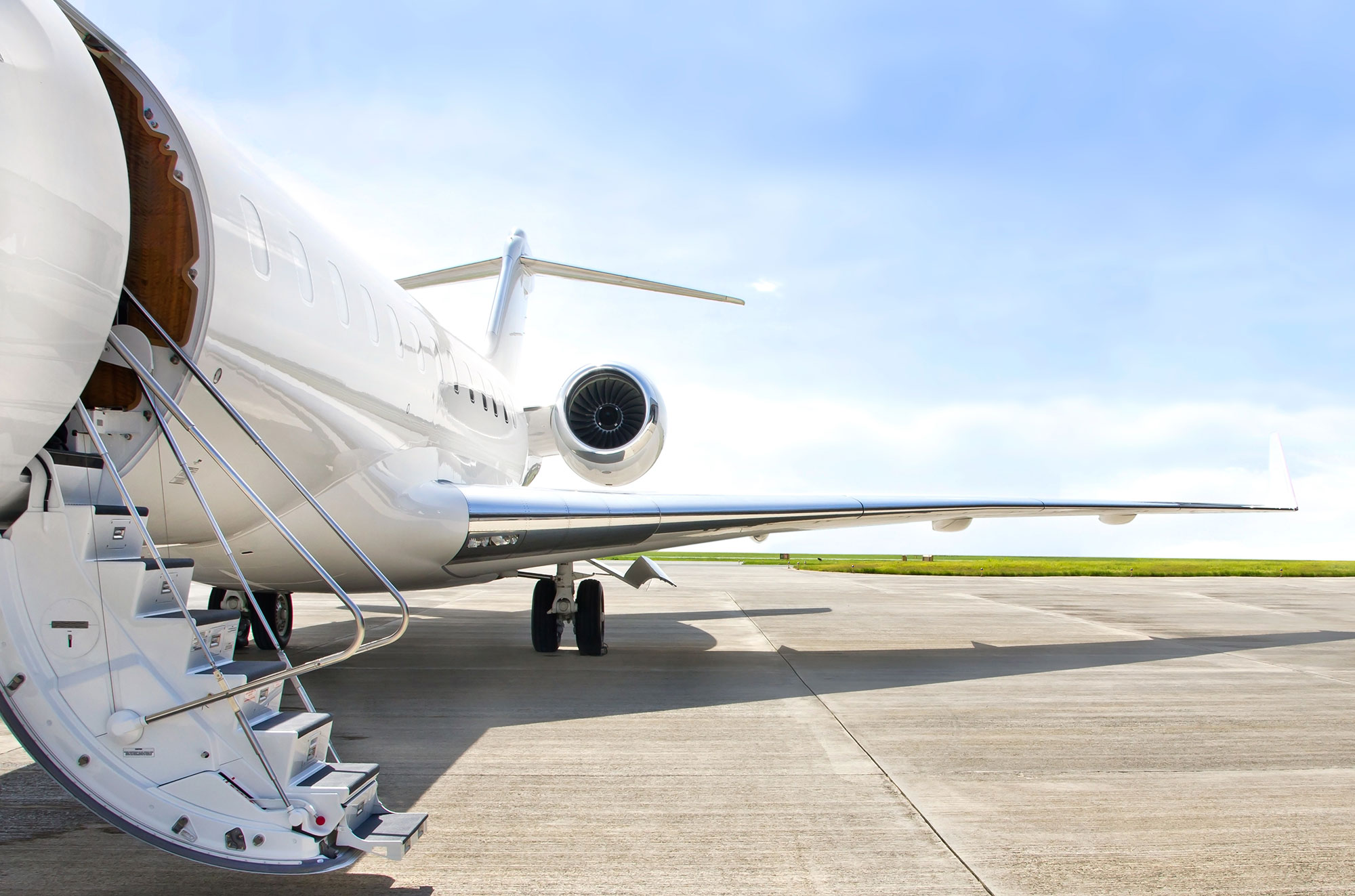 airplane on tarmac with stairs down